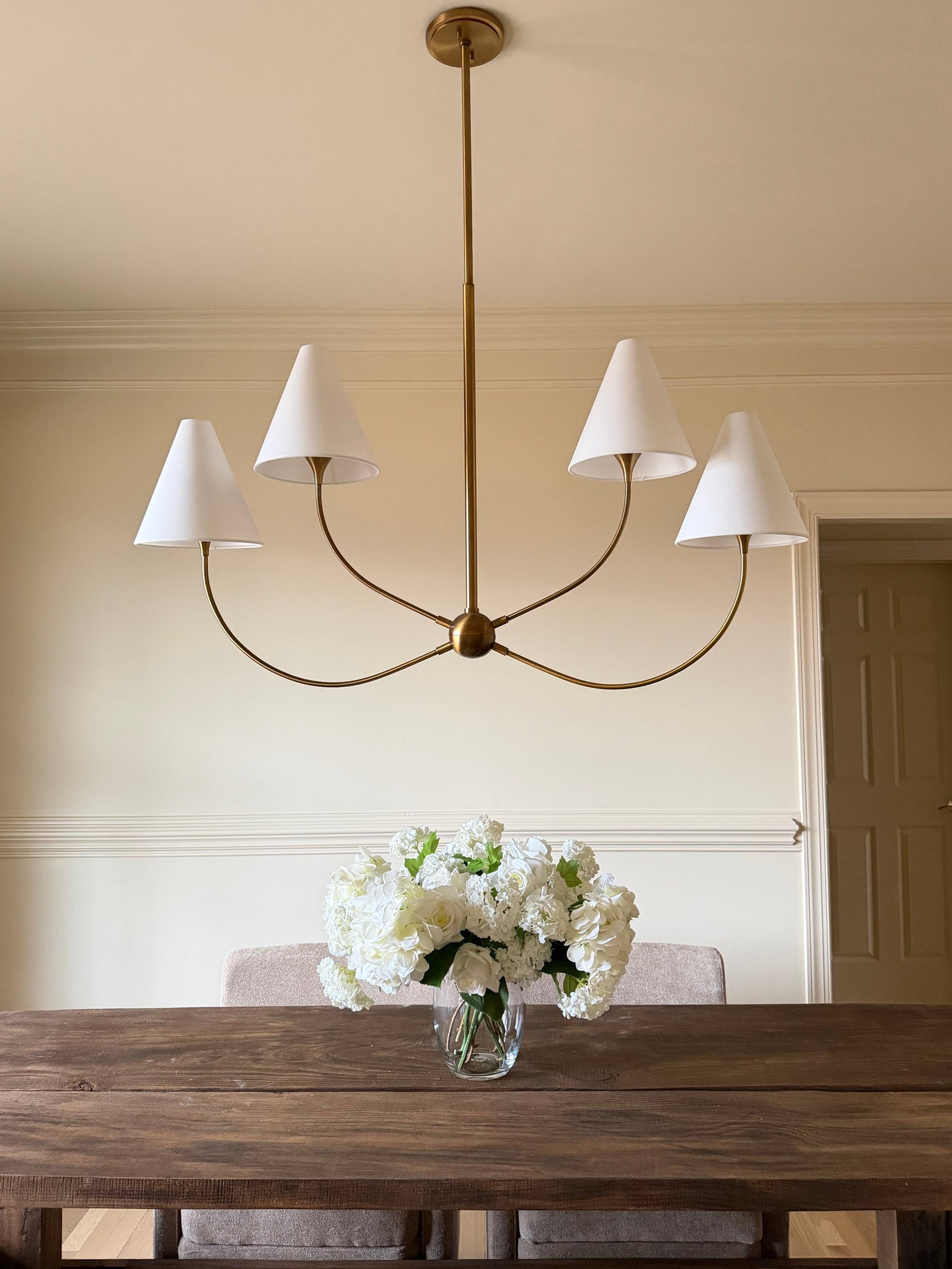 Evermore Linear styled in a kitchen island for warm, layered light at Laurie Yapp Home.