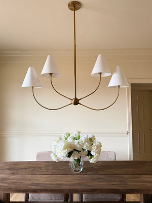 Evermore Linear styled in a kitchen island for warm, layered light at Laurie Yapp Home.