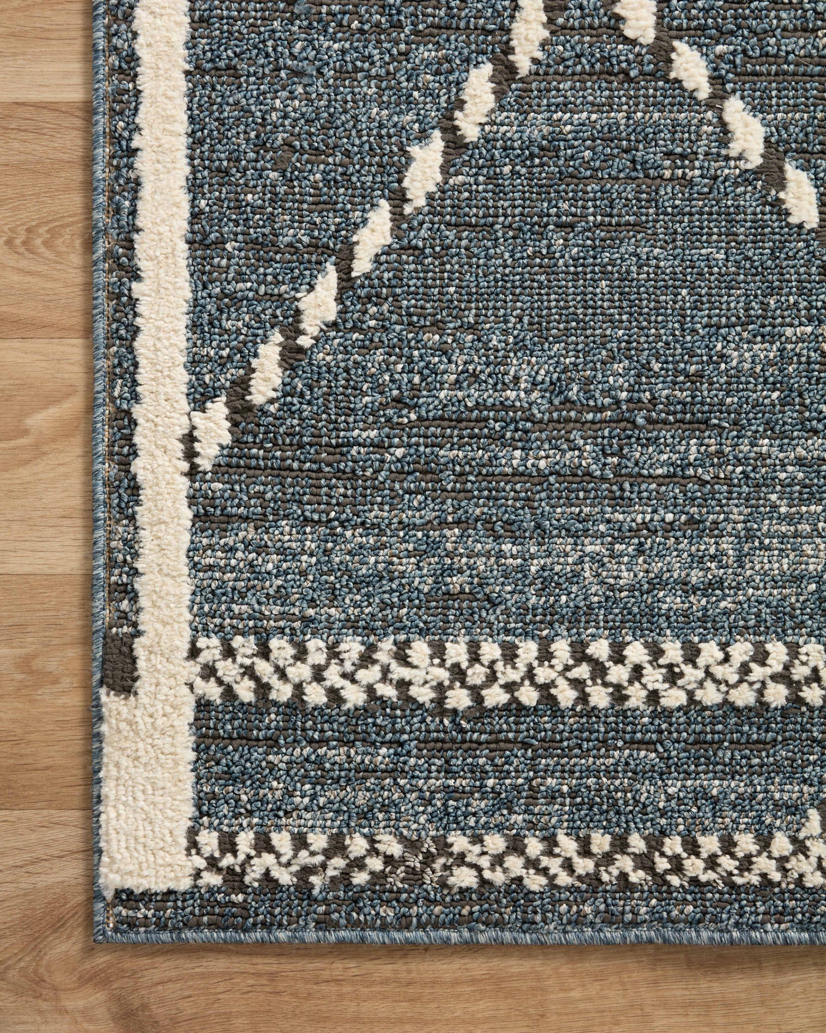 Fabian Denim / Charcoal styled in a living room at Laurie Yapp Home.