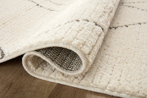 Close-up detail of the Fabian Ivory / Charcoal showing its pile and weave.