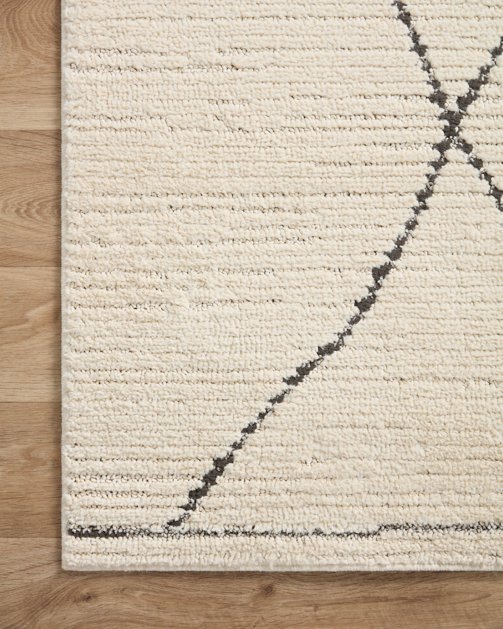 Fabian Ivory / Charcoal styled in a living room at Laurie Yapp Home.