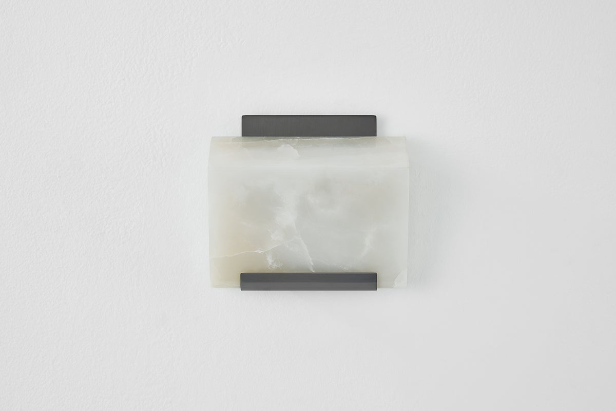 Close-up of the Fairfield Wall Sconce in bronze showing the arm curve and shade silhouette.