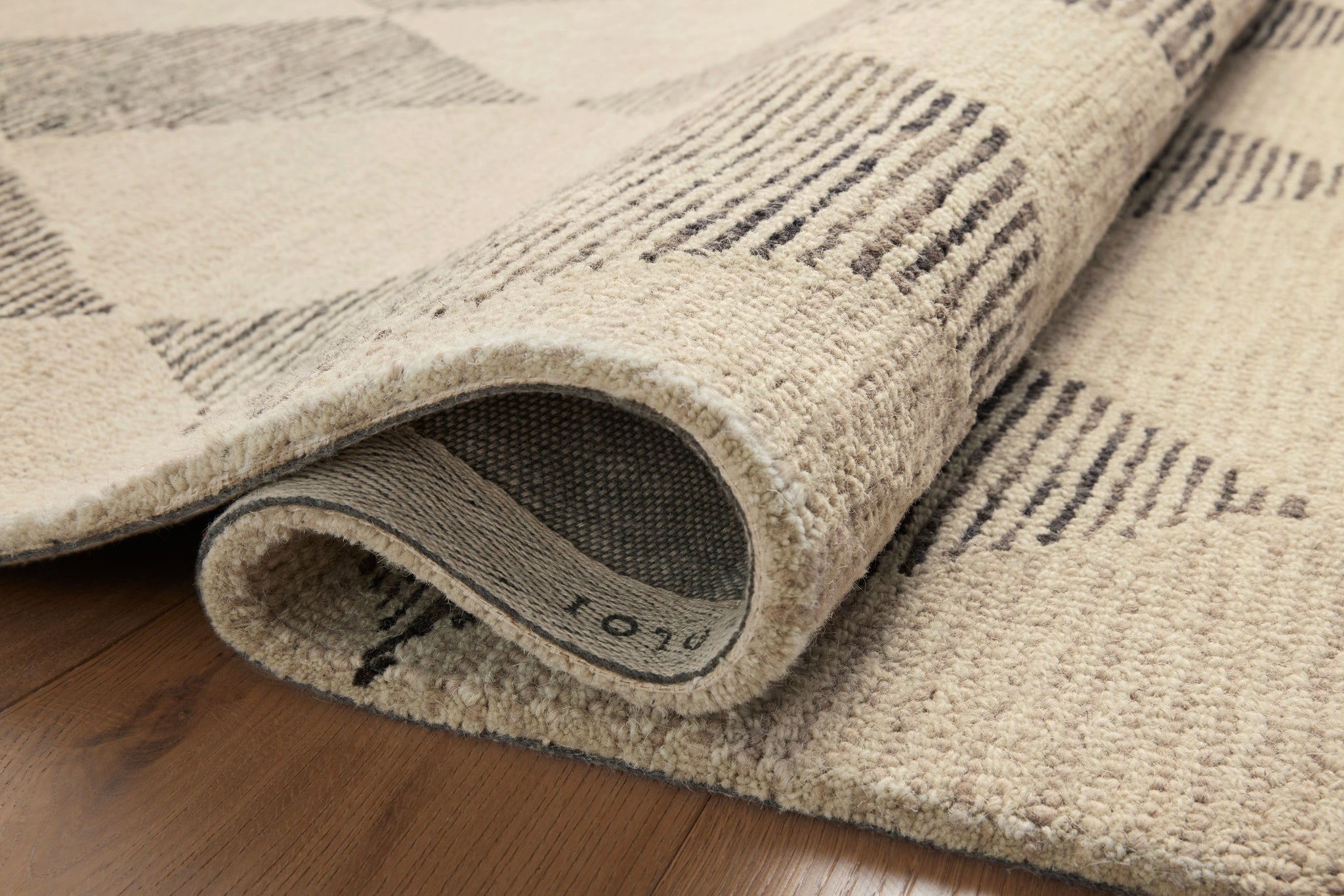 Francis Beige / Charcoal shown from a different angle to reveal its pattern.