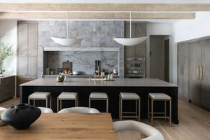 Fabius Pendant 36" styled in a welcoming entryway for warm, layered light at Laurie Yapp Home.