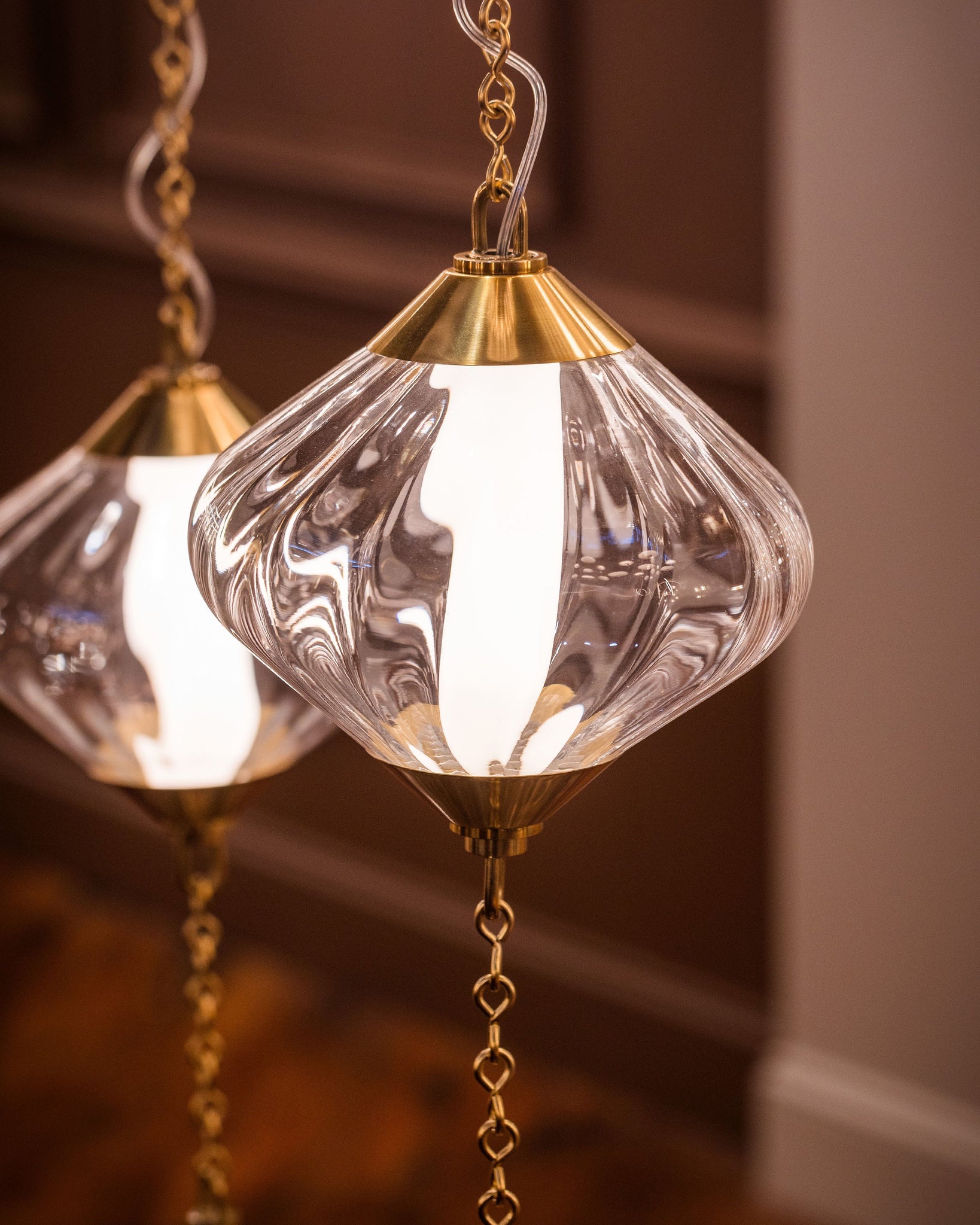 Fiorello Chandelier styled in an elegant dining room for warm, layered light at Laurie Yapp Home.