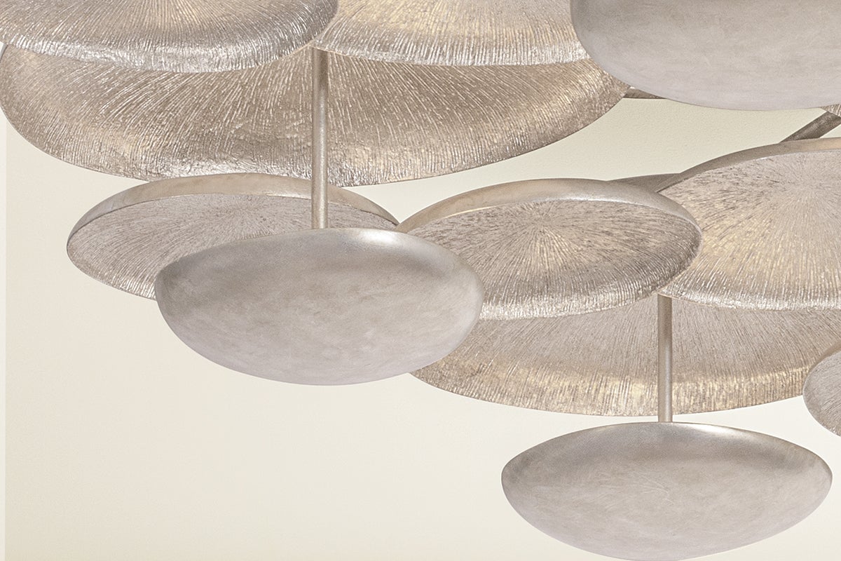 Close-up of the Fistral Semi Flush 58.5" showing the shade profile and mounting canopy.