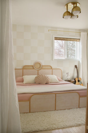 Foster Semi Flush in aged brass styled in a bedroom for warm, layered light at Laurie Yapp Home.
