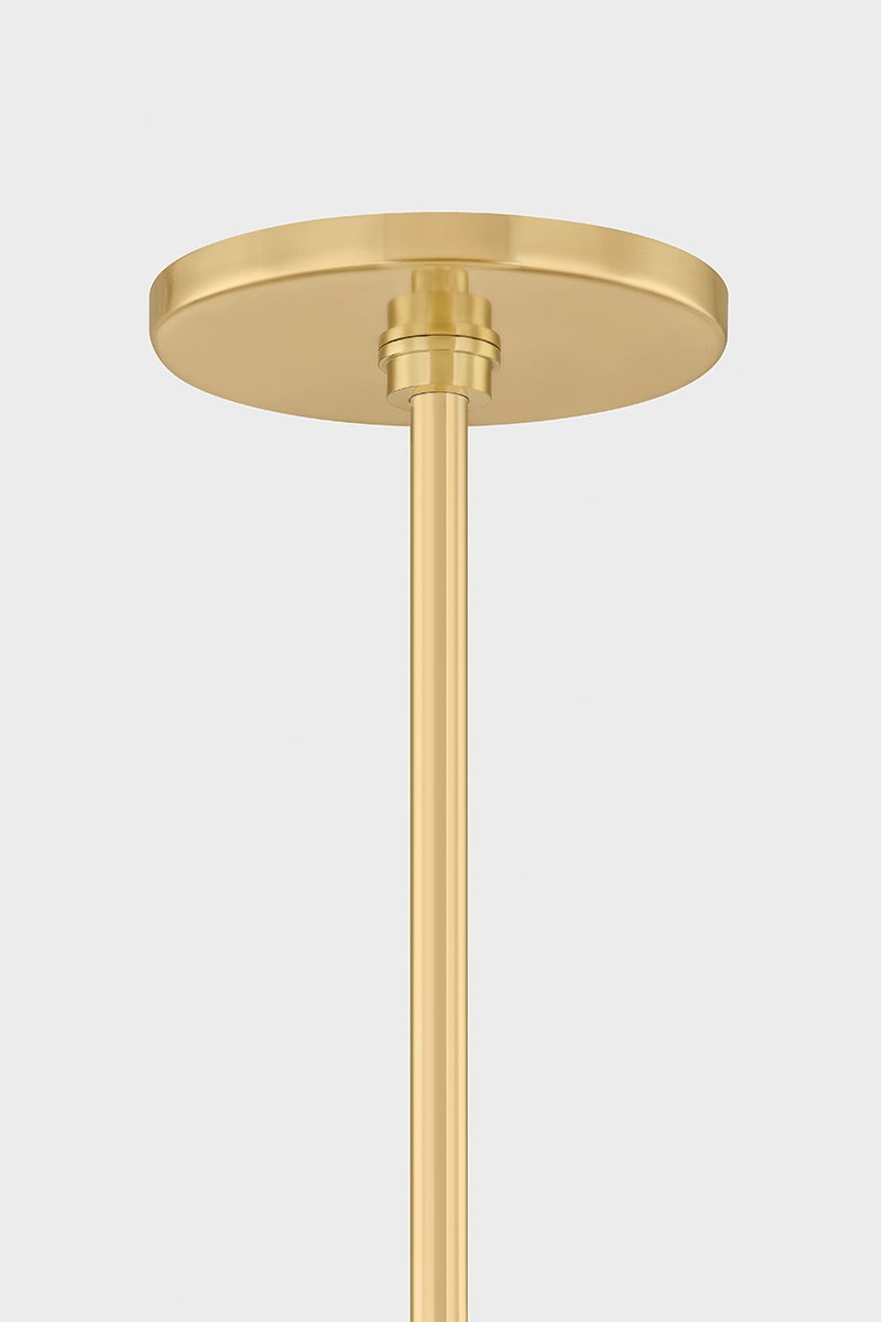 George Pendant 30" in aged brass shown from a second angle to highlight the shade shape and metal detail.