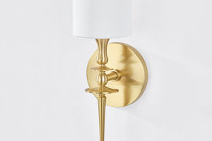 Close-up of the Guilford Wall Sconce in aged brass showing the arm curve and shade silhouette.