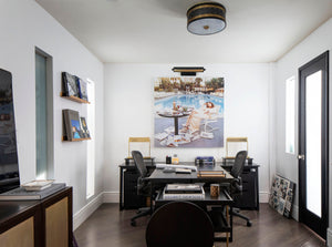 Gaines Picture Light 18.25" in aged brass styled in a reading room for warm, layered light at Laurie Yapp Home.