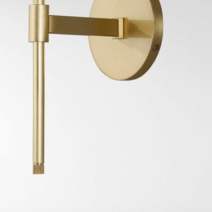 Glenmoore Wall Sconce in aged brass shown from the front to reveal the arm curve and shade silhouette.