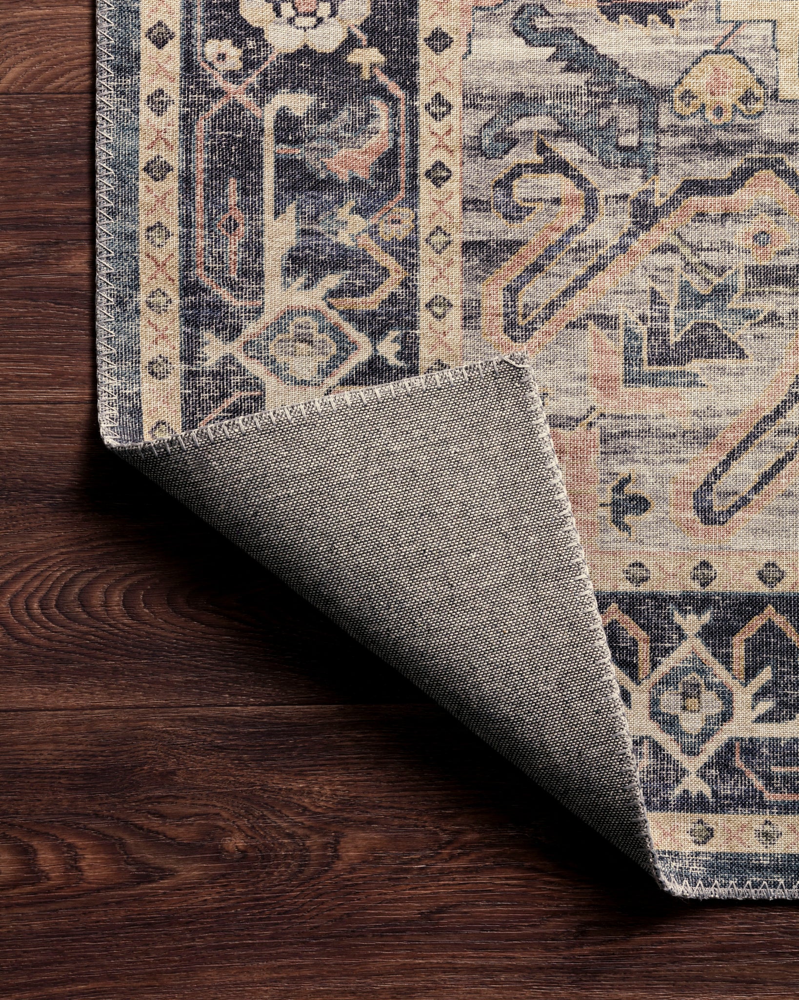 Hathaway Navy / Multi shown in a styled living room vignette at Laurie Yapp Home.