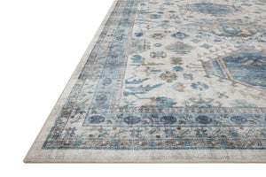 Side view of the Heidi Ivory / Ocean rug.