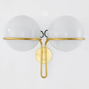 Hingham Wall Sconce in aged brass shown from a second angle to highlight the arm curve and shade silhouette.