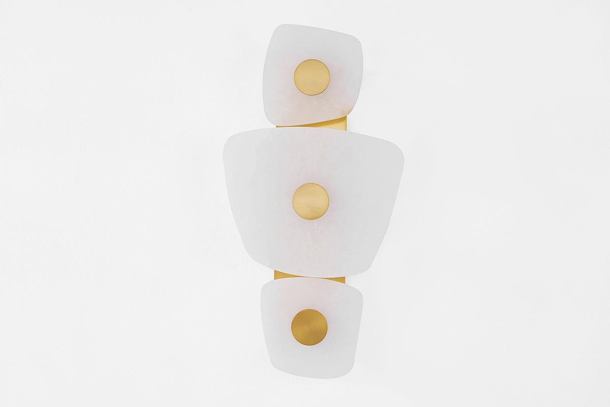 Holmdel Wall Sconce in aged brass shown from a second angle to highlight the arm curve and shade silhouette.