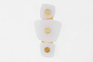 Holmdel Wall Sconce in aged brass shown from a second angle to highlight the arm curve and shade silhouette.