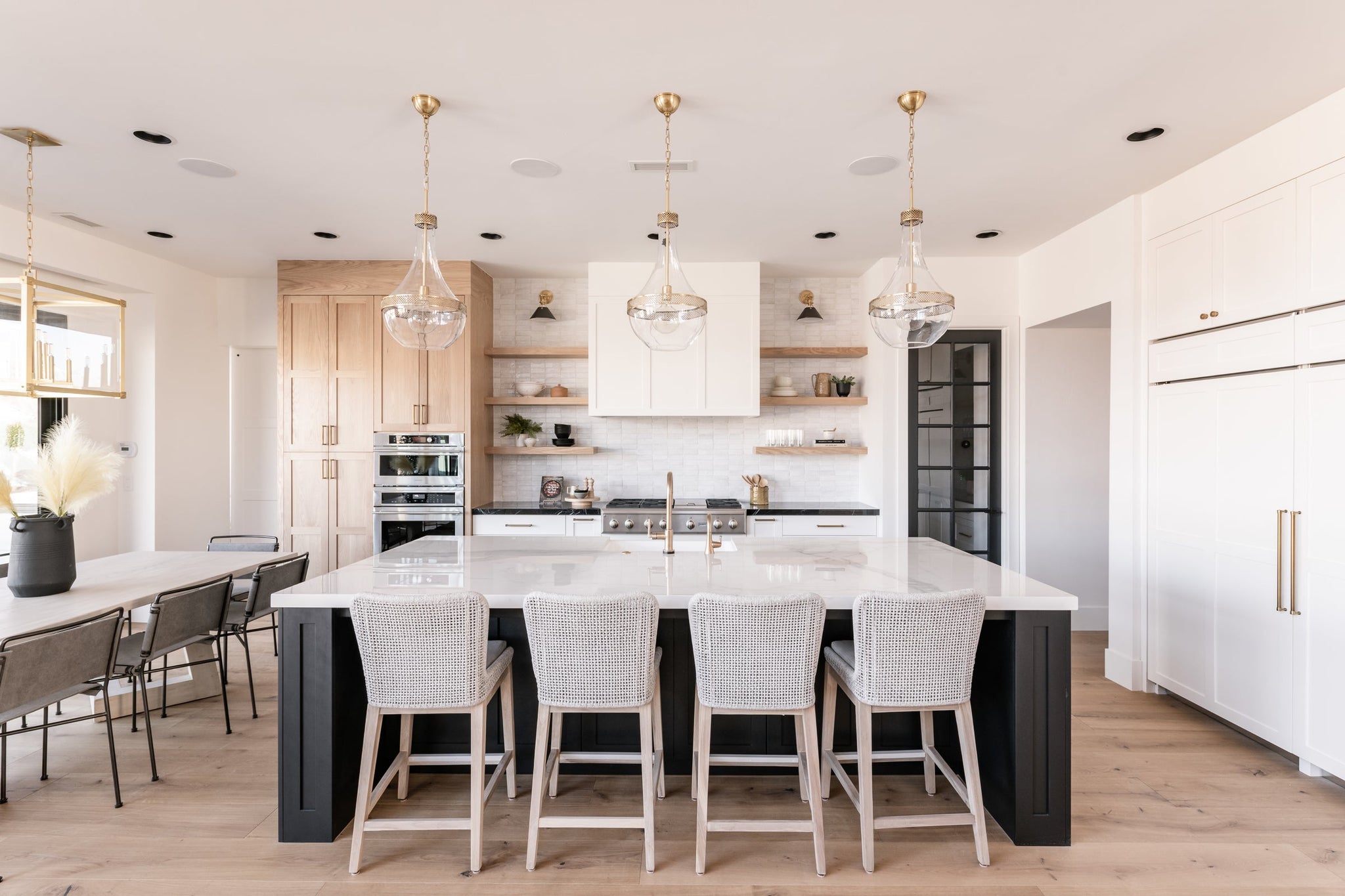 Hagen Pendant 14" in aged brass styled in an elegant dining room for warm, layered light at Laurie Yapp Home.