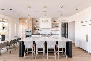 Hagen Pendant 14" in aged brass styled in an elegant dining room for warm, layered light at Laurie Yapp Home.