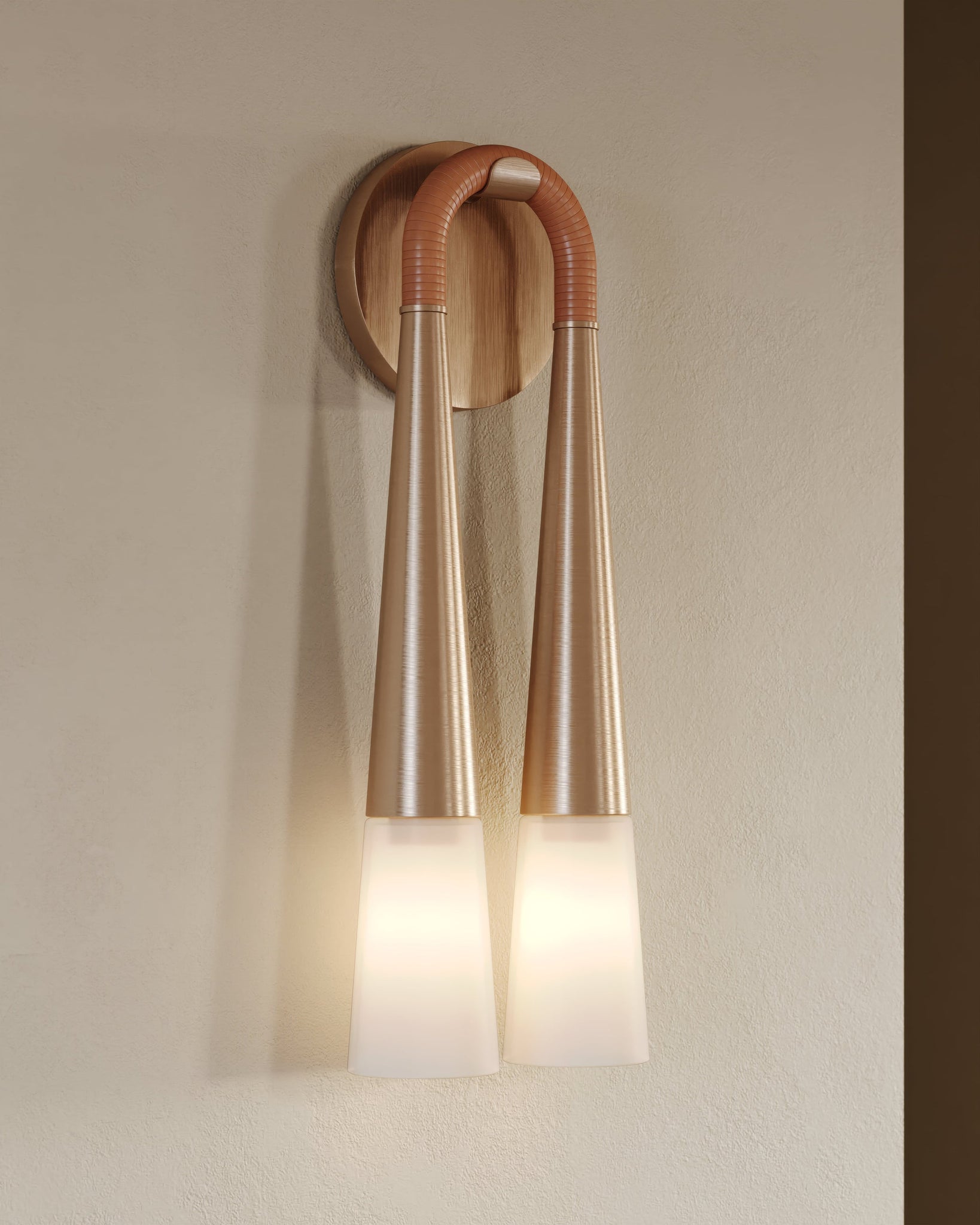 Hawke Wall Sconce styled in a warmly lit hallway for warm, layered light at Laurie Yapp Home.