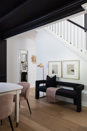 Highgrove Floor Lamp 7" in aged brass styled in a bedroom for warm, layered light at Laurie Yapp Home.