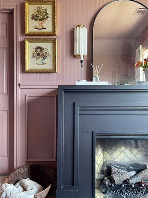 Hillside Wall Sconce 6" x 13.5" in aged brass styled in a warmly lit hallway for warm, layered light at Laurie Yapp Home.