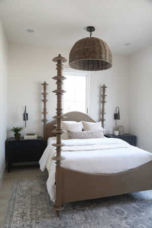 Alva Wall Sconce 4.25" in bronze styled in a curated living room for warm, layered light at Laurie Yapp Home.