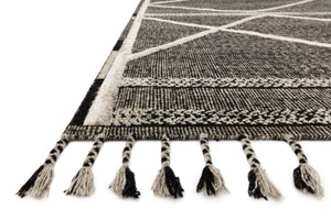 Side view of the Iman Beige / Charcoal rug.