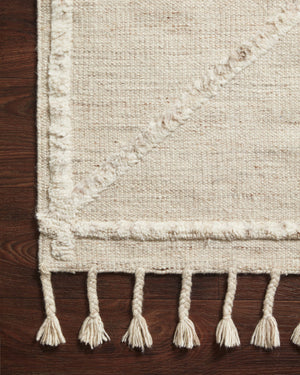 Side view of the Iman Beige / Ivory rug.