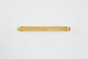 Judd Picture Light 26.5" in aged brass shown from the front to reveal the arm curve and shade proportion.