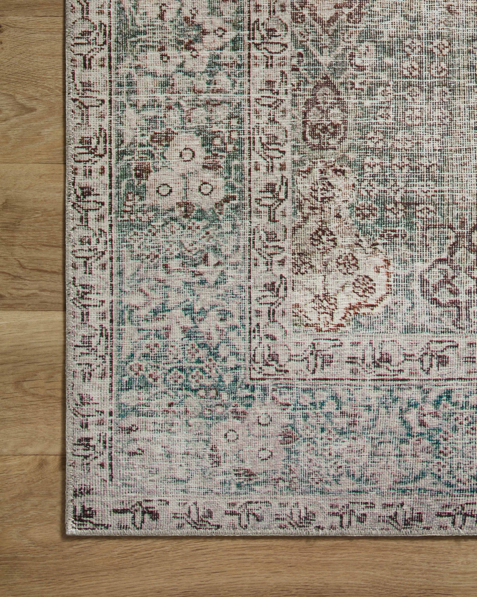 Jules Emerald / Antique Ivory shown from a different angle to reveal its pattern.