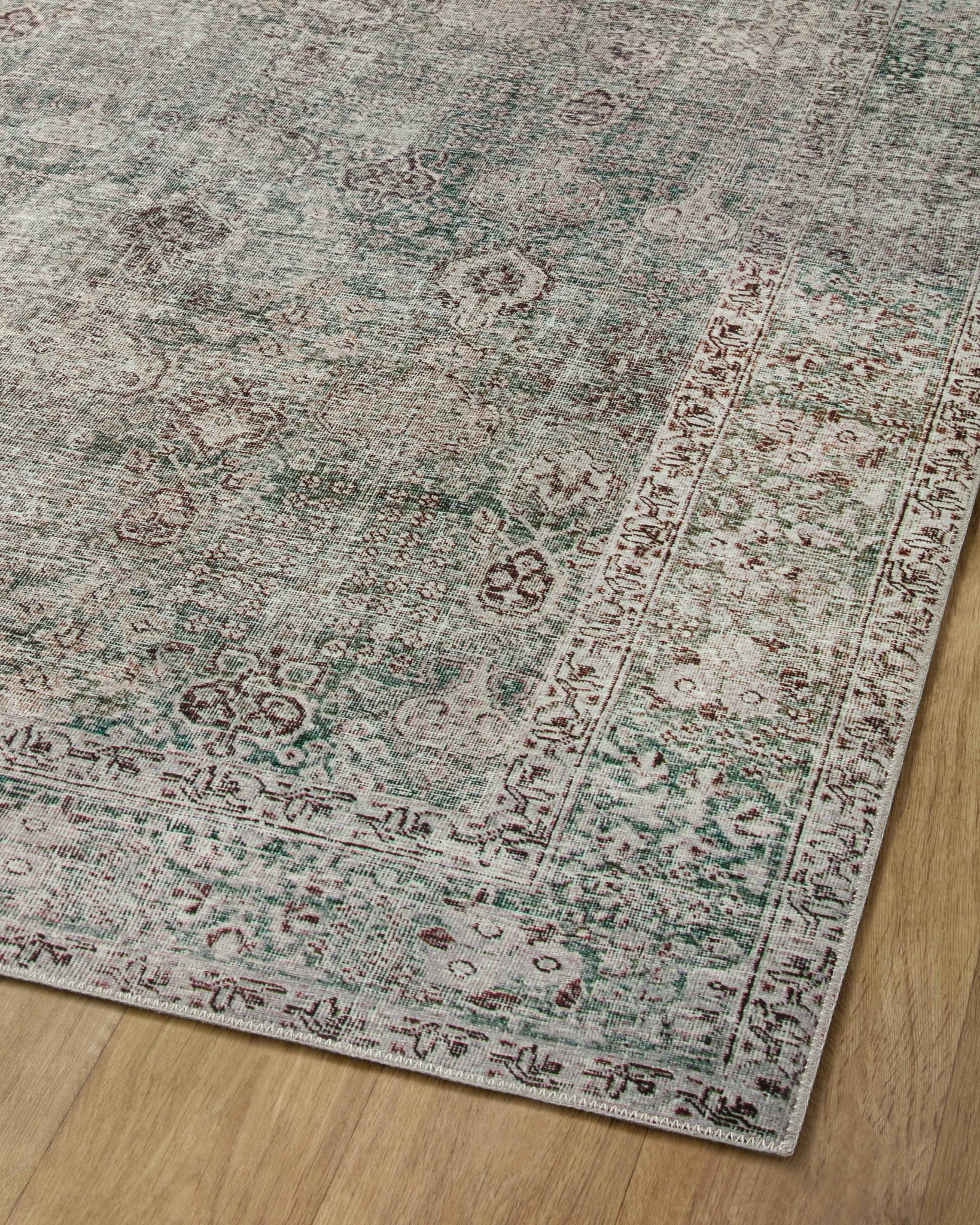 Jules Emerald / Antique Ivory shown from a different angle to reveal its pattern.