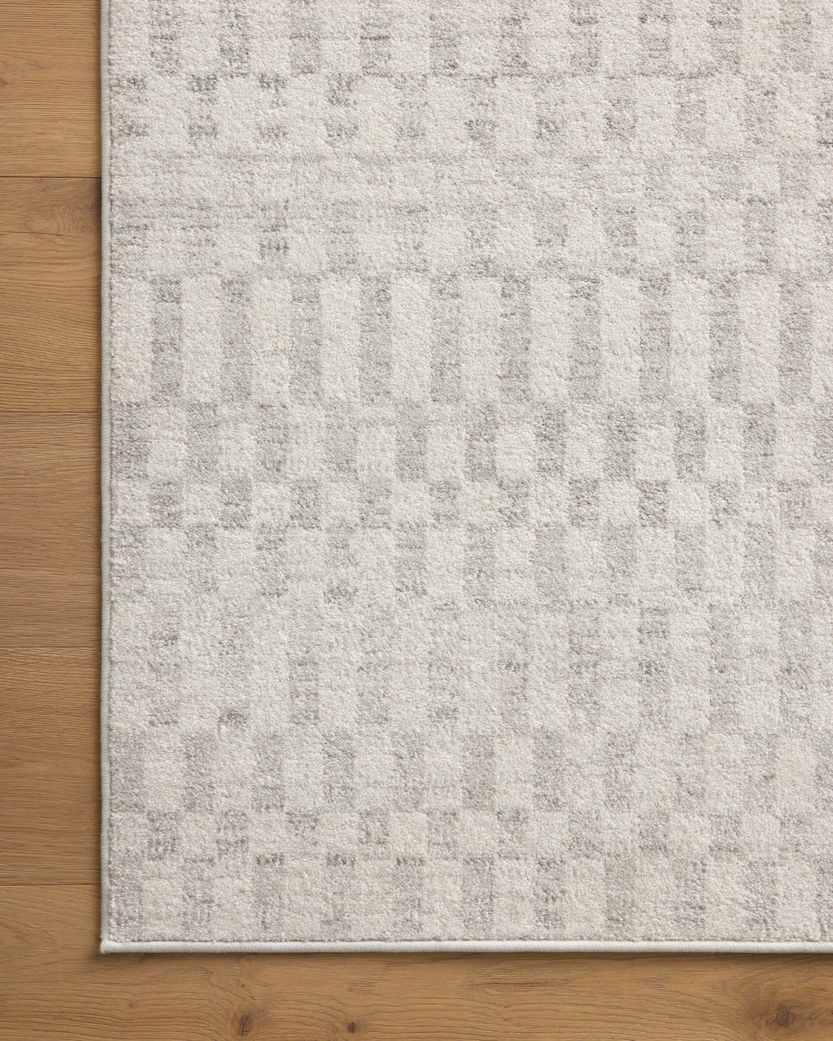 Kamala Ivory / Grey shown from a different angle to reveal its pattern.