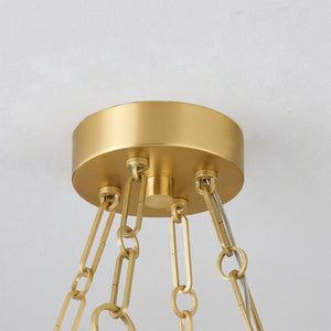 Kirby Chandelier 30" x 3.5" in aged brass shown from the front to reveal the frame, arms, and shade detail.