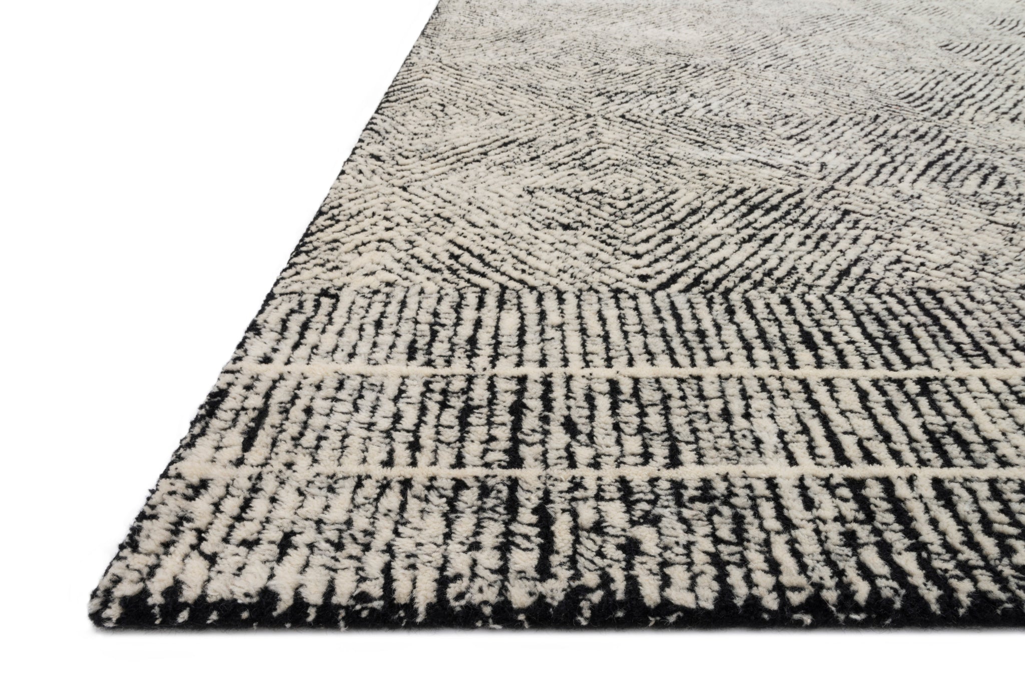Side view of the Kopa Black / Ivory rug.
