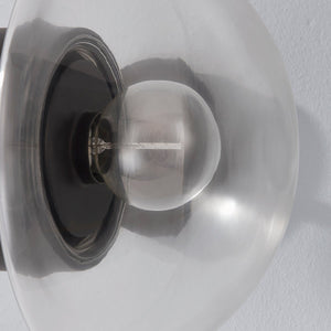 Close-up of the Kert Wall Sconce showing the arm curve and shade silhouette.
