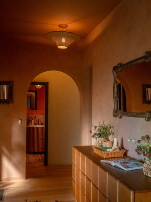 Ketan Semi Flush styled in a hallway for warm, layered light at Laurie Yapp Home.
