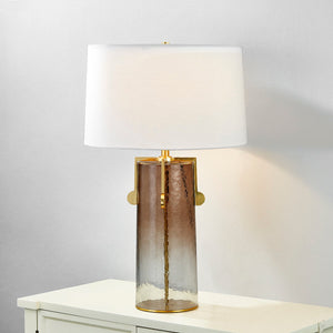 Wildwood Table Lamp in aged brass shown from the front to reveal the base and shade proportions.