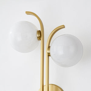 Laval Wall Sconce 10.5" in aged brass shown from the front to reveal the arm curve and shade silhouette.