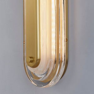 Close-up of the Litton Wall Sconce 5.75" x 28" in aged brass showing the arm curve and shade silhouette.