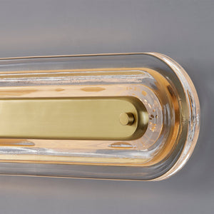 Close-up of the Litton Wall Sconce 5.75" x 21.25" in aged brass showing the arm curve and shade silhouette.