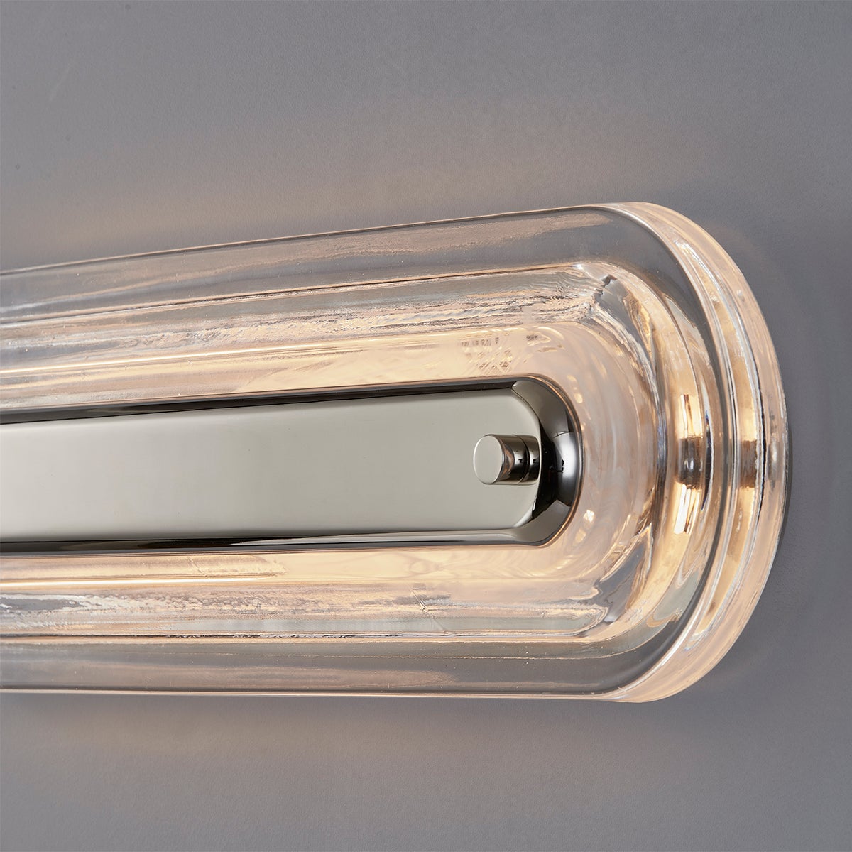 Close-up of the Litton Wall Sconce 5.75" x 21.25" in polished nickel showing the arm curve and shade silhouette.