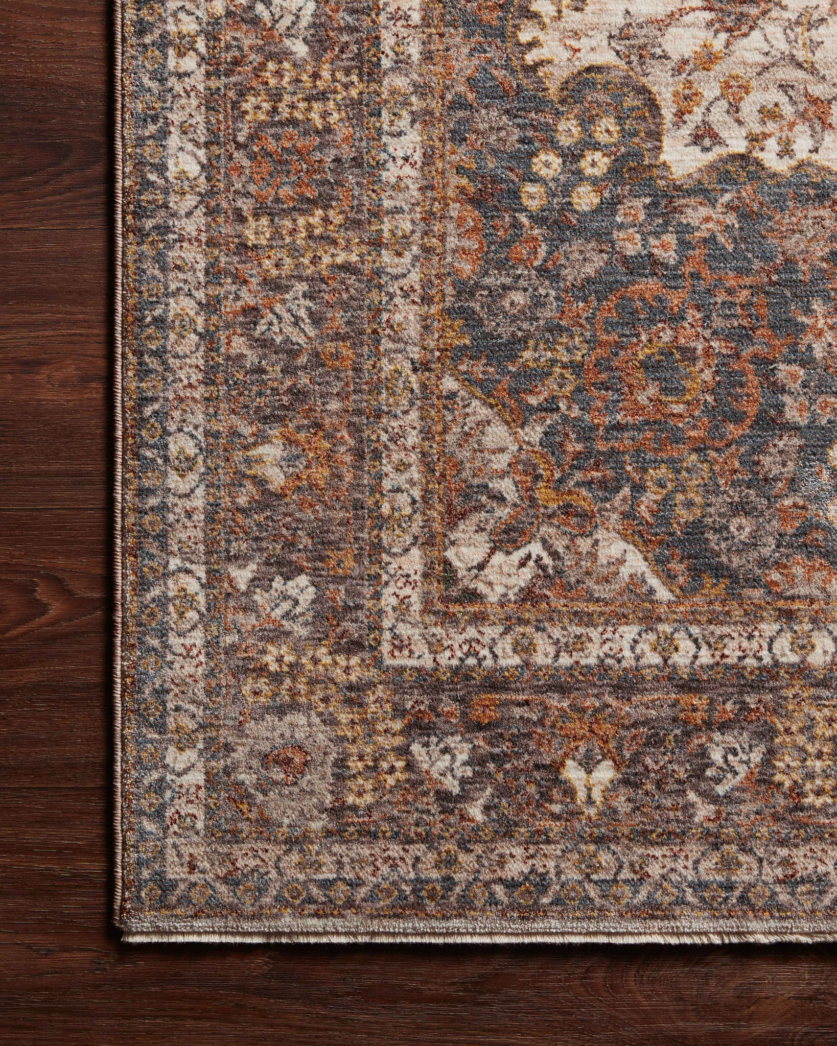 Side view of the Lourdes Natural / Ocean rug.