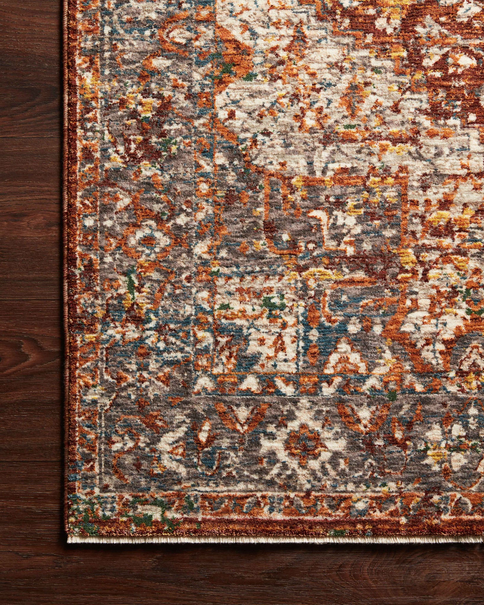 Side view of the Lourdes Rust / Multi rug.
