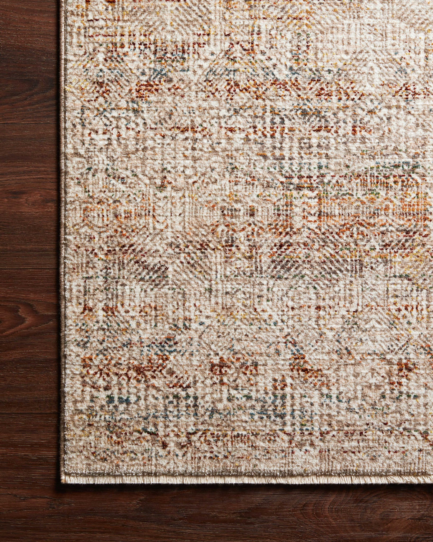 Side view of the Lourdes Ivory / Spice rug.