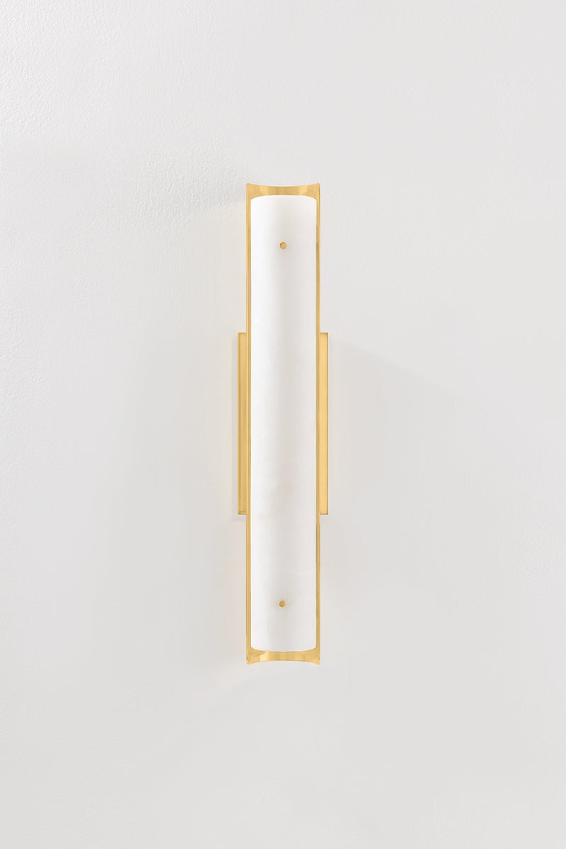 Lucio Wall Sconce 4.25" x 22.5" in aged brass shown from a second angle to highlight the arm curve and shade silhouette.