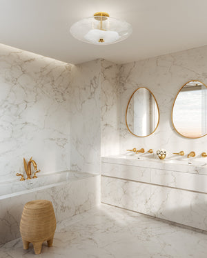 Lago Semi Flush 24" in aged brass styled in a bedroom for warm, layered light at Laurie Yapp Home.