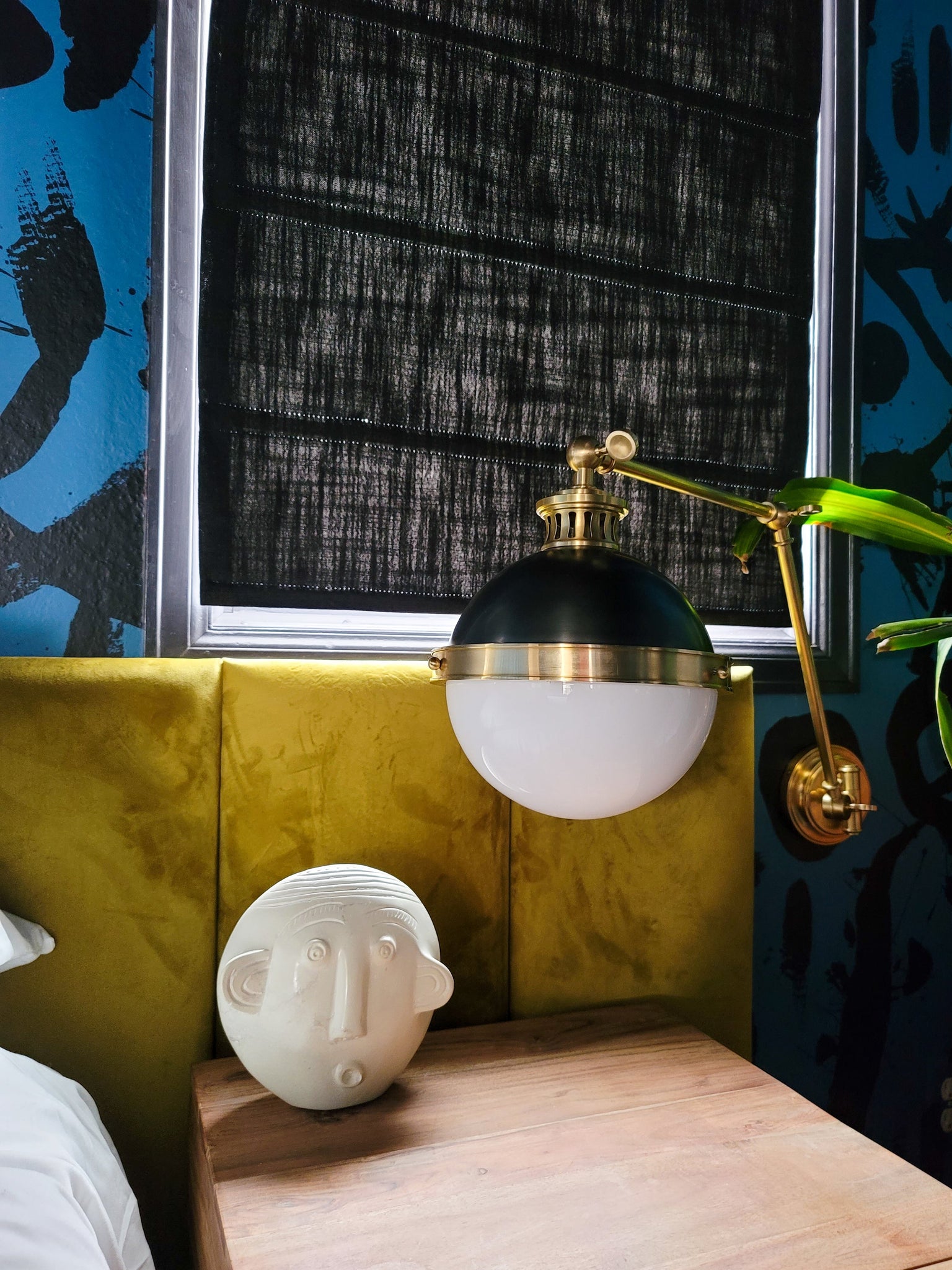 Latham Wall Sconce styled in a modern bathroom for warm, layered light at Laurie Yapp Home.