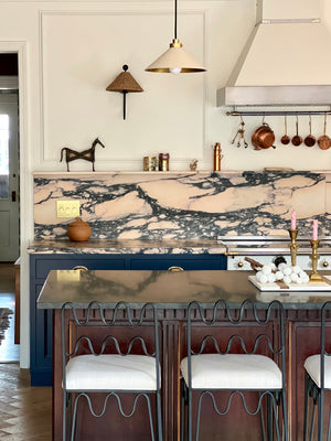 Layton Wall Sconce styled in a curated living room for warm, layered light at Laurie Yapp Home.