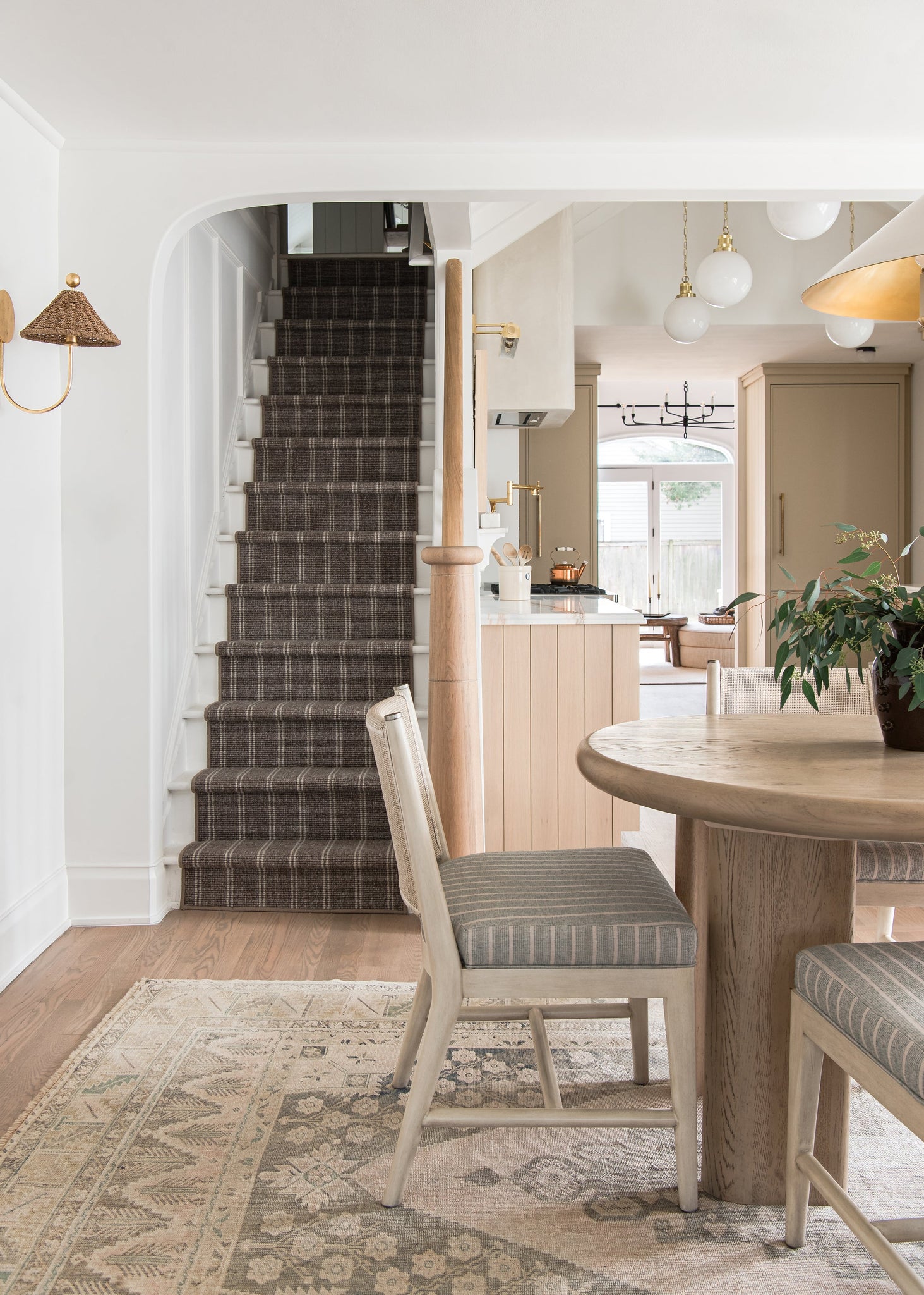 Hampshire Picture Light 23.25" in aged brass styled in a gallery wall for warm, layered light at Laurie Yapp Home.