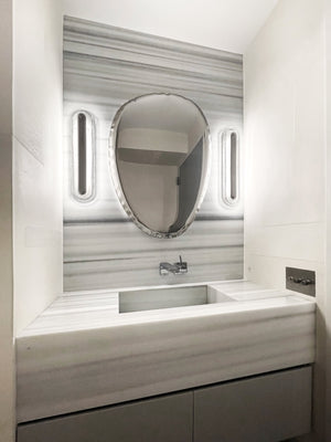 Litton Wall Sconce 5.75" x 21.25" in polished nickel styled in a warmly lit hallway for warm, layered light at Laurie Yapp Home.